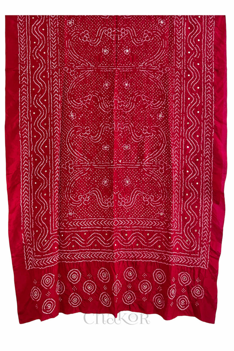 full view of red Bandhani mulberry silk dupatta with tie-dye dot pattern with mirror work.
