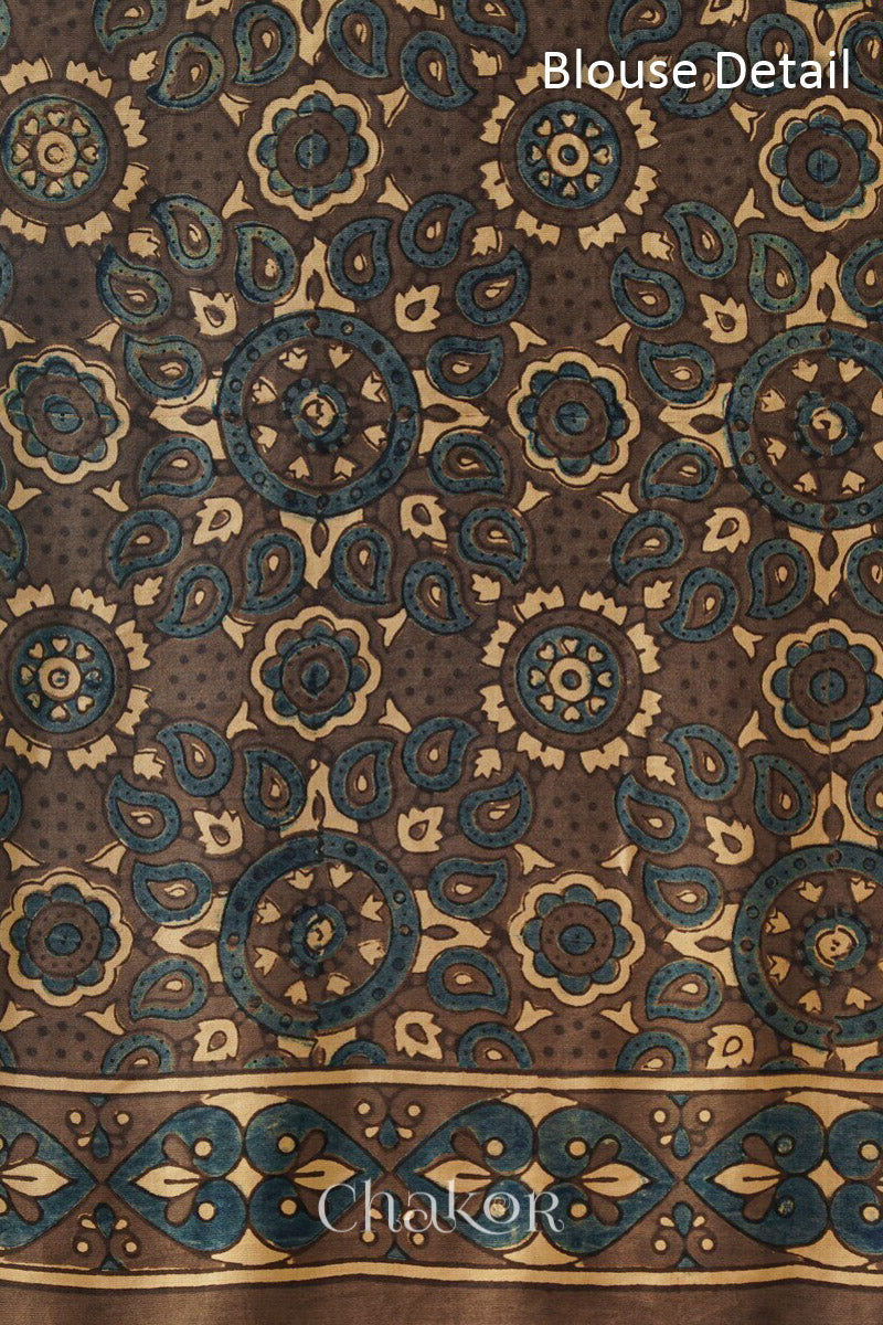 Blouse material - close up of Parrot green Bandhani Saree with Brown Ajrakh printed border and pallu in pure gaji silk with traditional bandhej tie-dye, handcrafted in Kutch.
