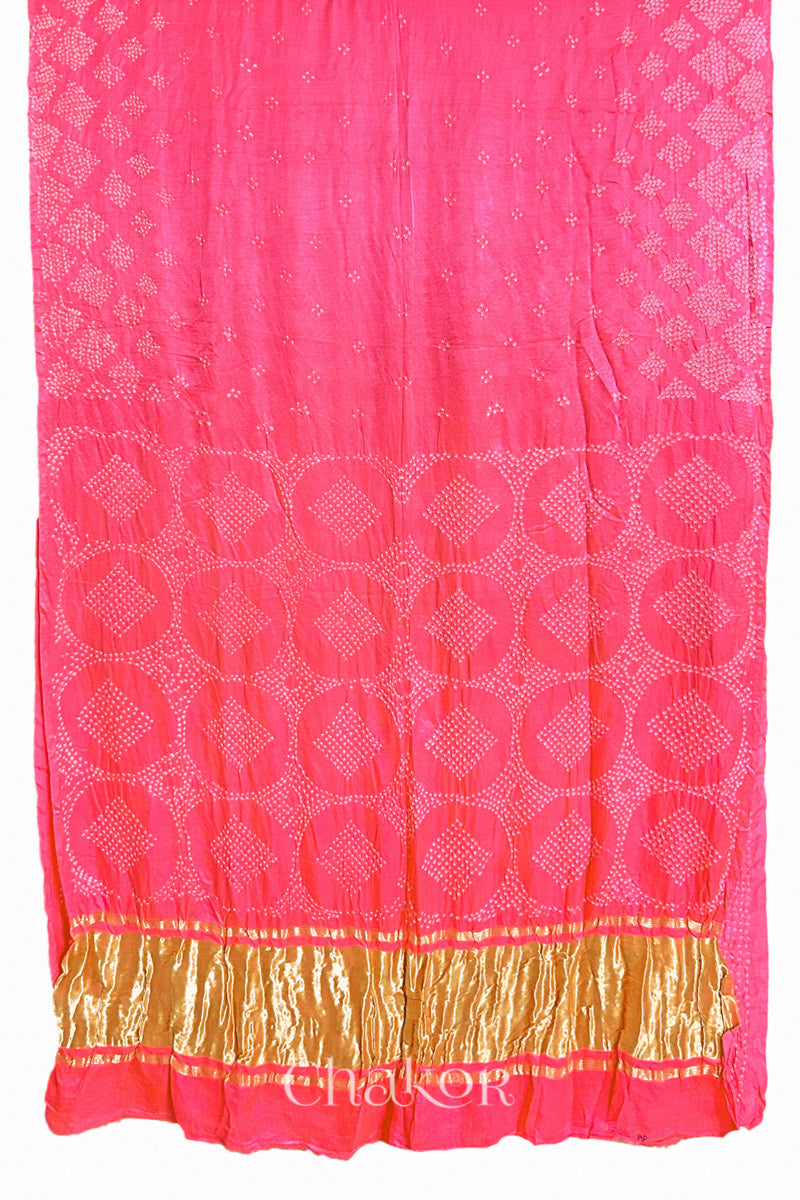 Full view of Handcrafted Coral Pink Bandhani Gaji Silk Saree with rai bandhej patterns and tissue pallu.