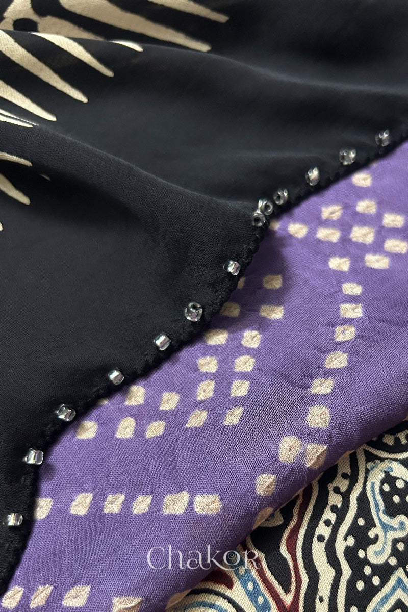 Mauve Bandhani and black Ajrakh combination modal stole with glass bead edging detail on pallu end.