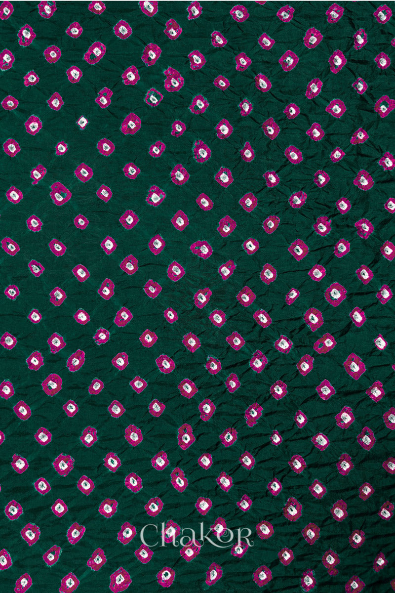 Dark Green Mulberry silk fabric showcasing dual colour Pink bandhani patterns and Chakor brand watermark.