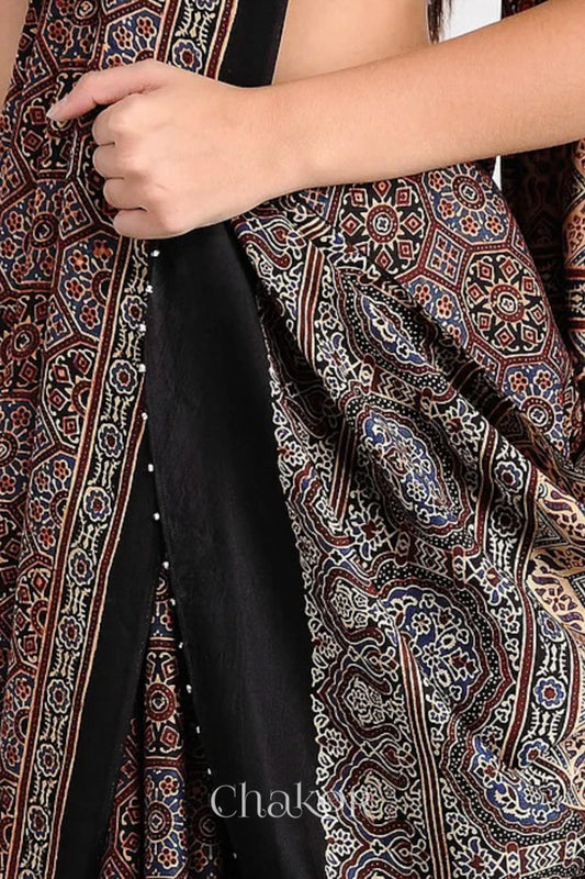 Woman Wearing Natural Dyed Black Ajrakh Printed Modal Cotton Saree Handcrafted in Kutch.