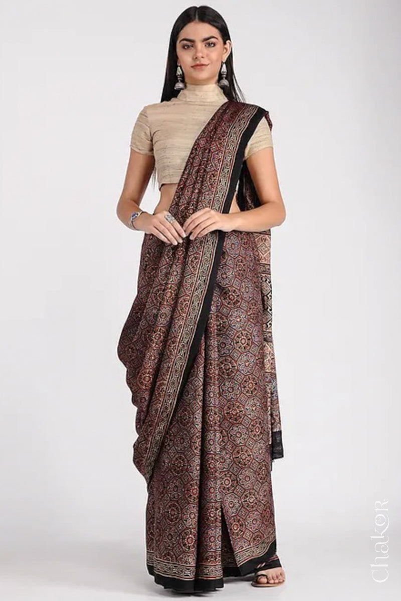 Woman Wearing Natural Dyed Black Ajrakh Printed Modal Cotton Saree Handcrafted in Kutch.