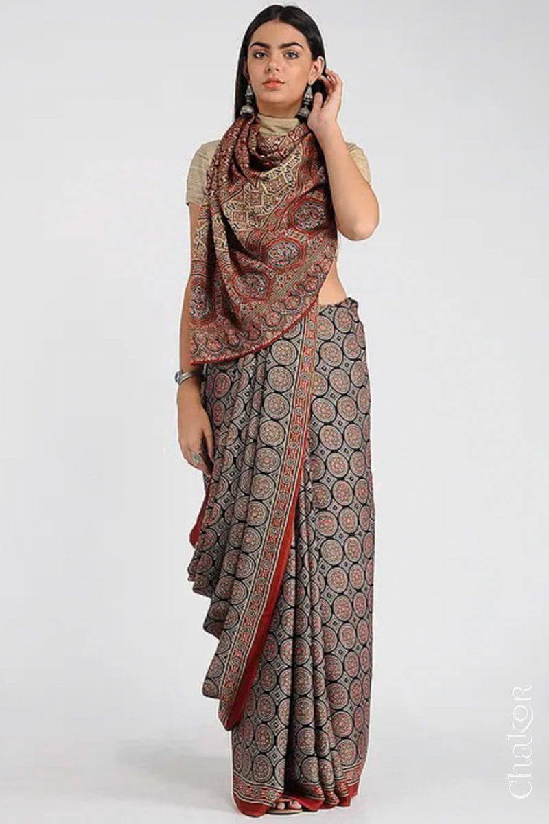 Woman Wearing Natural Dyed Madder Red Ajrakh Printed Modal Cotton Saree Handcrafted in Kutch.