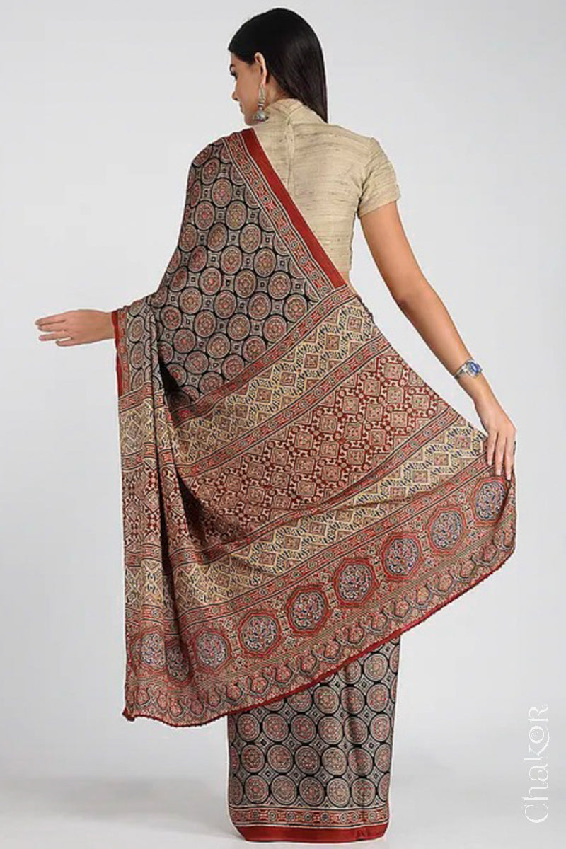 Woman Wearing Natural Dyed Madder Red Ajrakh Printed Modal Cotton Saree Handcrafted in Kutch.