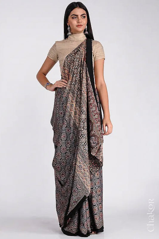 Woman wearing Natural Dyed Black Ajrakh Printed Modal Cotton Saree Handcrafted in Kutch.