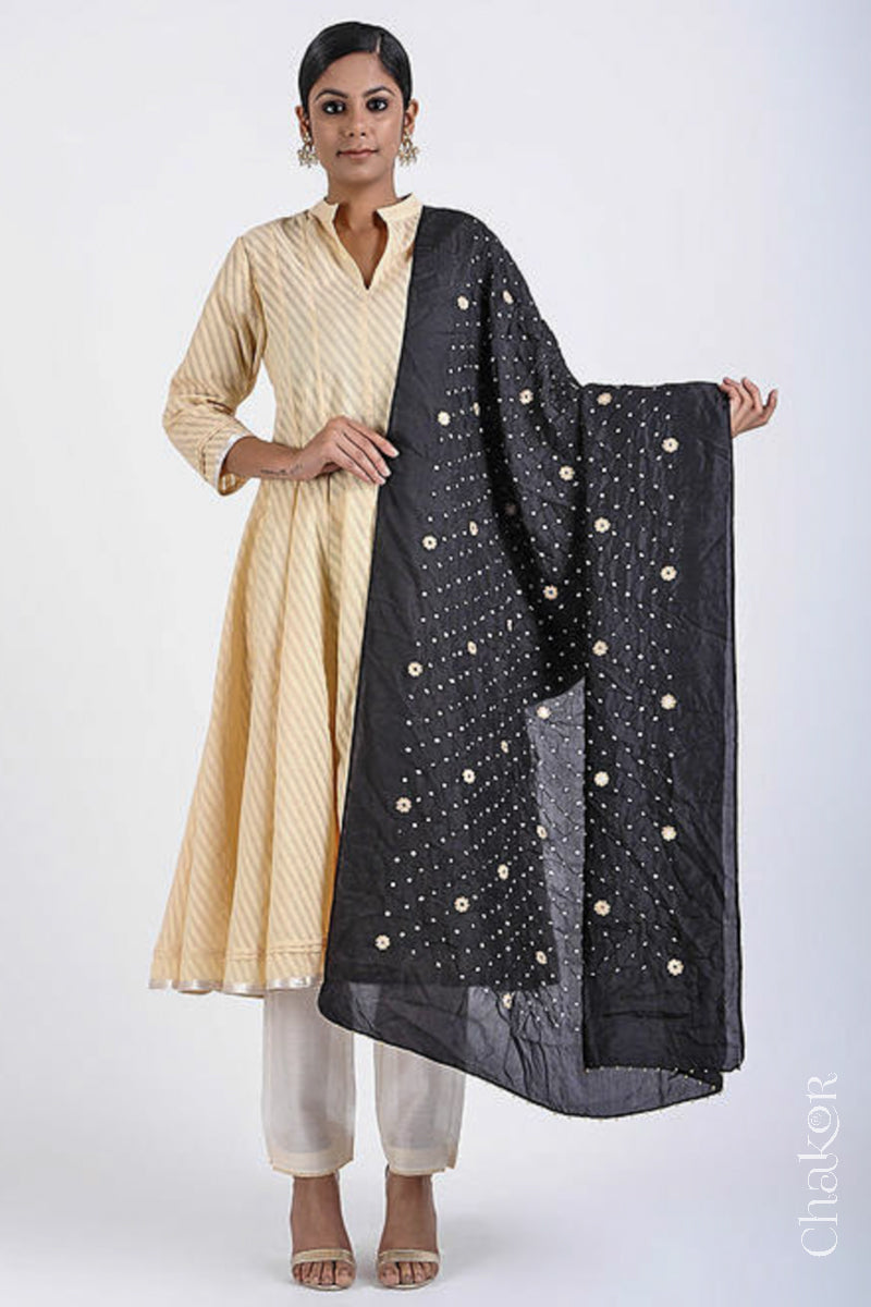Full view model wearing Black Bandhani Mulberry silk dupatta with sequins embroidery and bead edging.