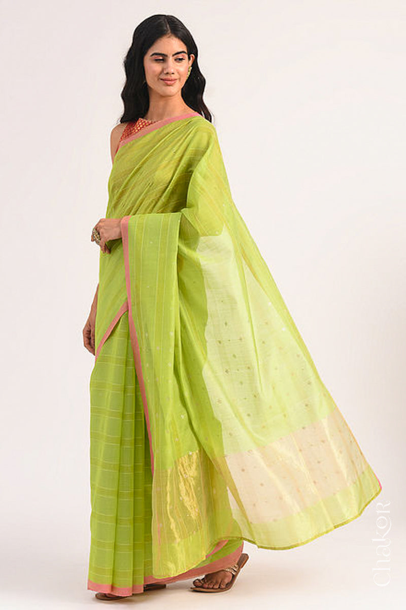Model wearing Lime Green Chanderi Silk Cotton Saree with zari embroidery.