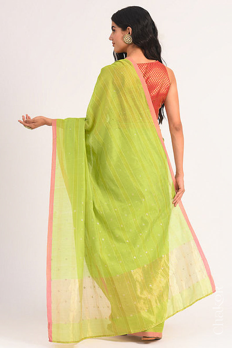 Back view of model wearing Lime Green Chanderi Silk Cotton Saree with zari embroidery.