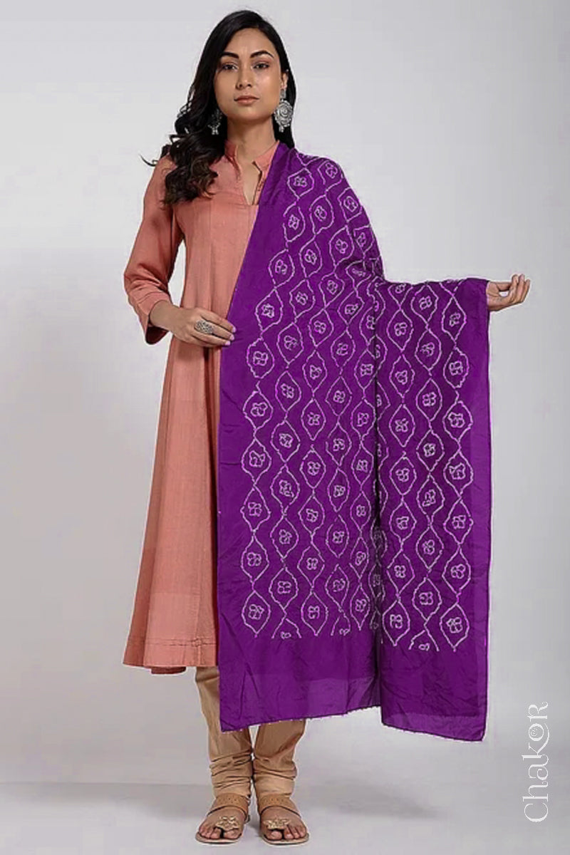Model wearing wine Bandhani mulberry silk dupatta with tie-dye dot pattern draped over a beige kurta.