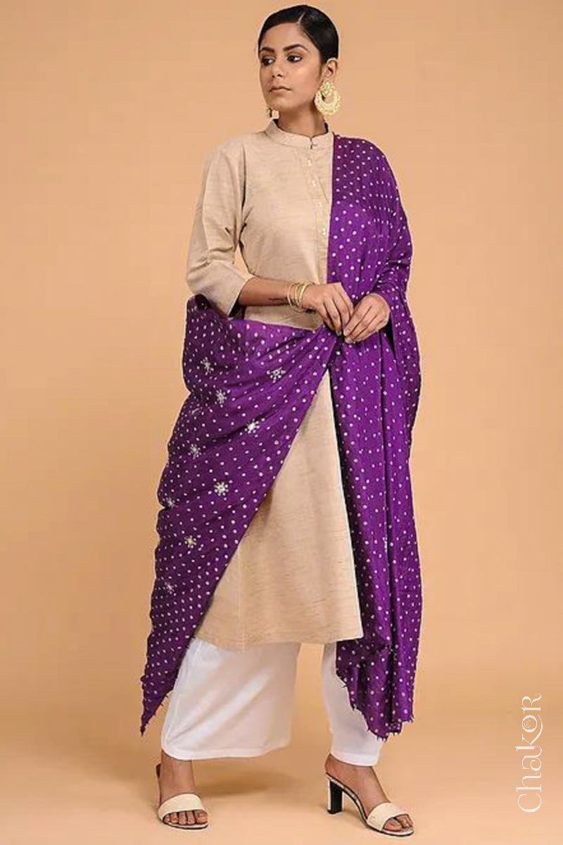 Full view of model wearing Wine Bandhani Mulberry Silk Dupatta featuring sequin and zari embroidery with beads pallu edgeover a beige kurta.