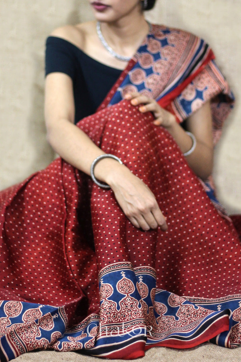 Woman Wearing Natural Dyed Madder Red Ajrakh Modal Saree Handcrafted in Kutch.