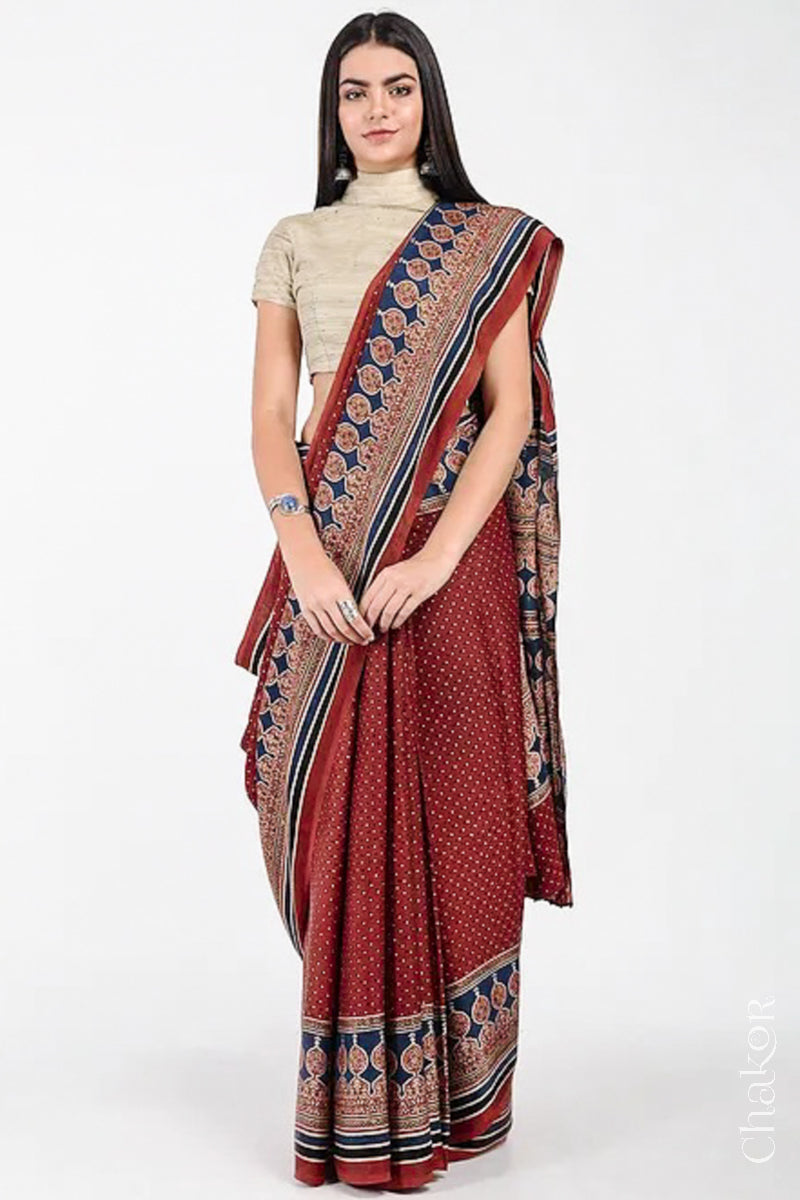 Woman Wearing Natural Dyed Madder Red Ajrakh Modal Saree Handcrafted in Kutch.