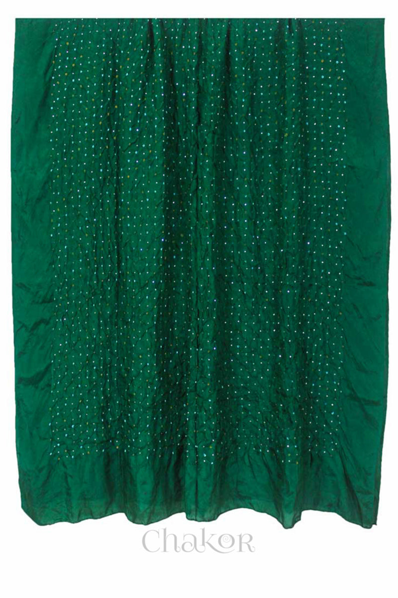 Full view of green Bandhani mulberry silk dupatta with tie-dye dot pattern & detailed with Mukaish work & Bead edging.