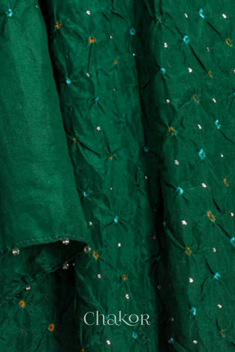 close-up of green Bandhani mulberry silk dupatta with tie-dye dot pattern & detailed with Mukaish work & Bead edging.