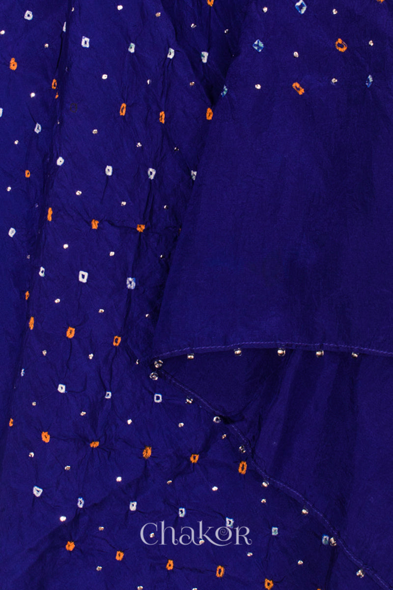 close-up of navy Bandhani mulberry silk dupatta with tie-dye dot pattern & detailed with Mukaish work & Bead edging.