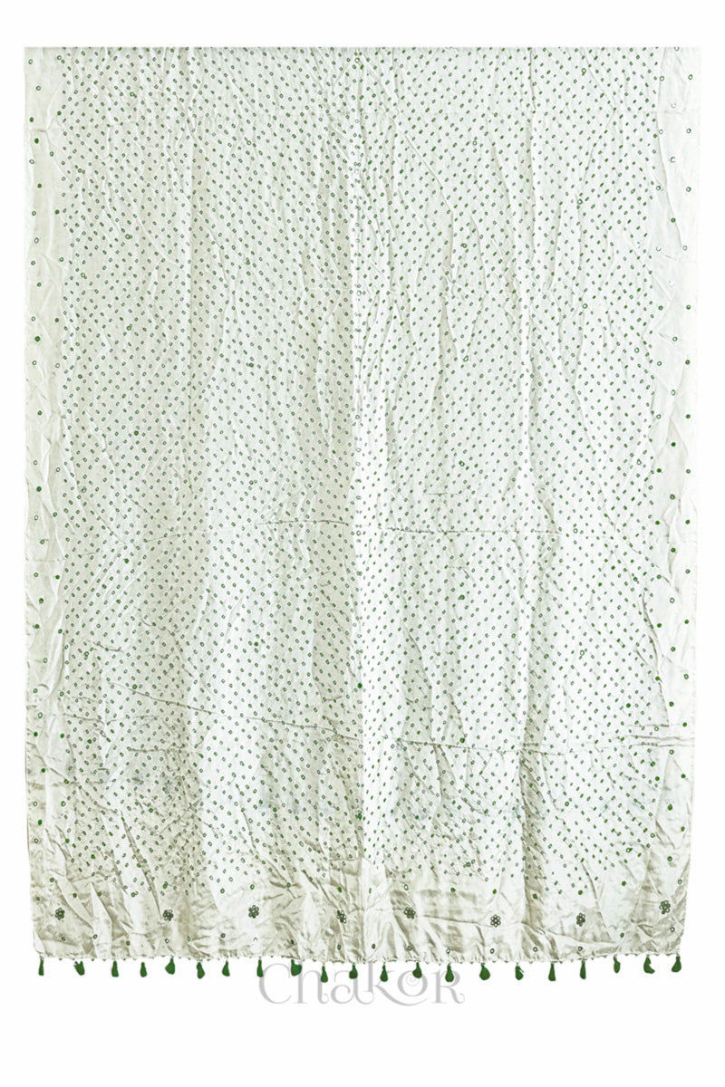 Full view of off white Bandhani mulberry silk dupatta with tie-dye dot pattern & detailed with Mirror work & tassels.