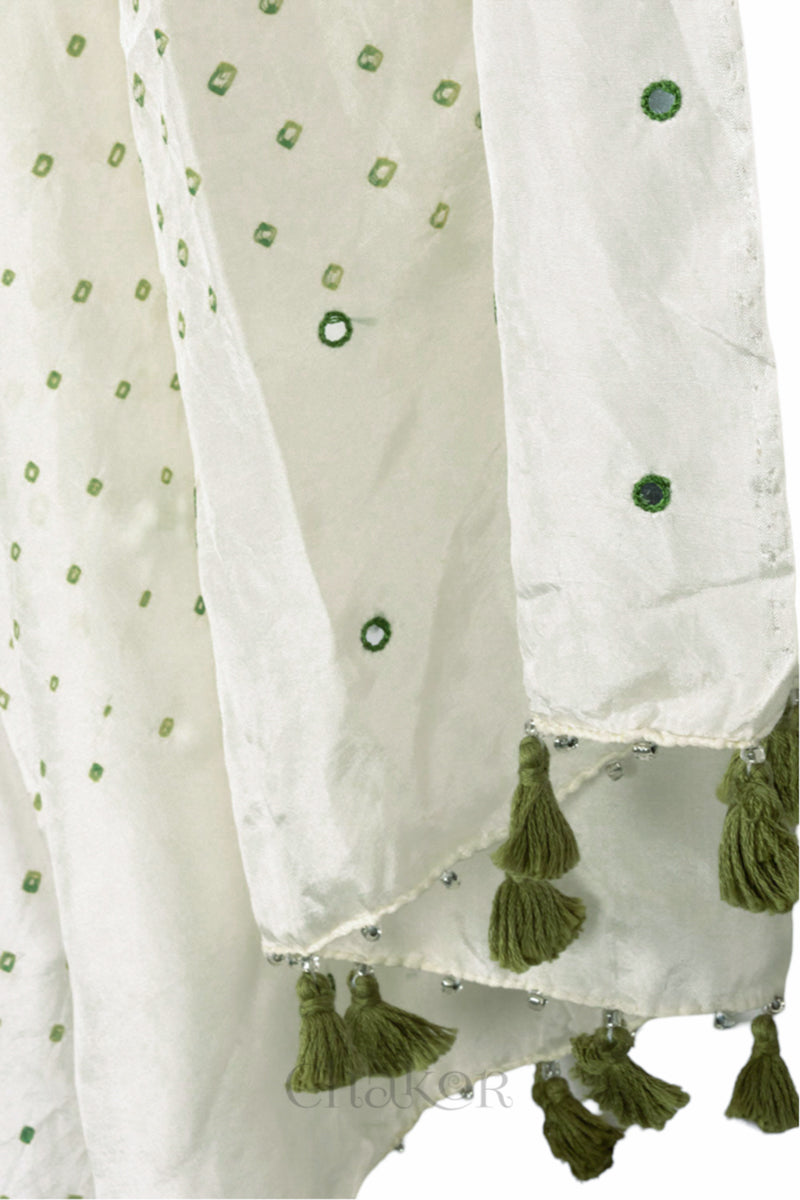 close up of off white Bandhani mulberry silk dupatta with tie-dye dot pattern & detailed with Mirror work & tassels.