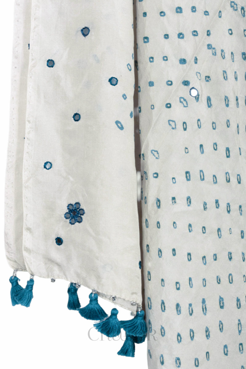 close up of off white Bandhani mulberry silk dupatta with tie-dye dot pattern & detailed with Mirror work & tassels.