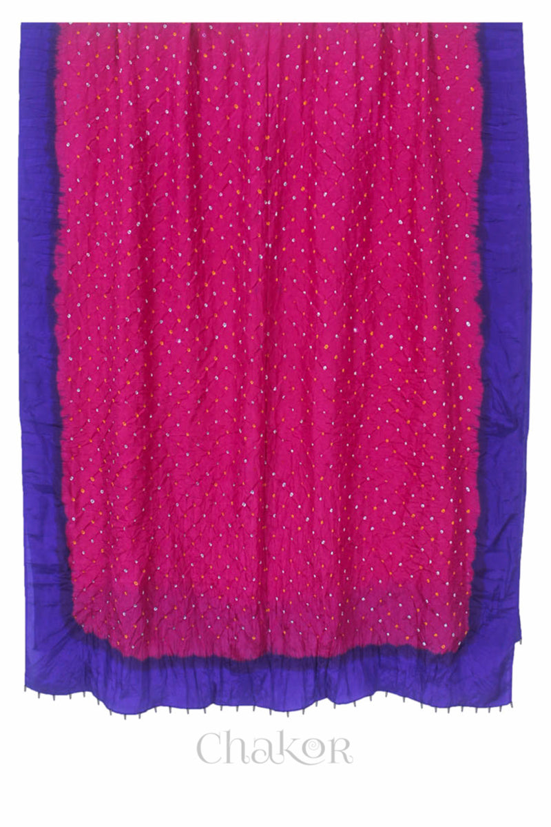 Full view of pink & purple border Bandhani mulberry silk dupatta with tie-dye dot pattern & detailed with Bead edging.