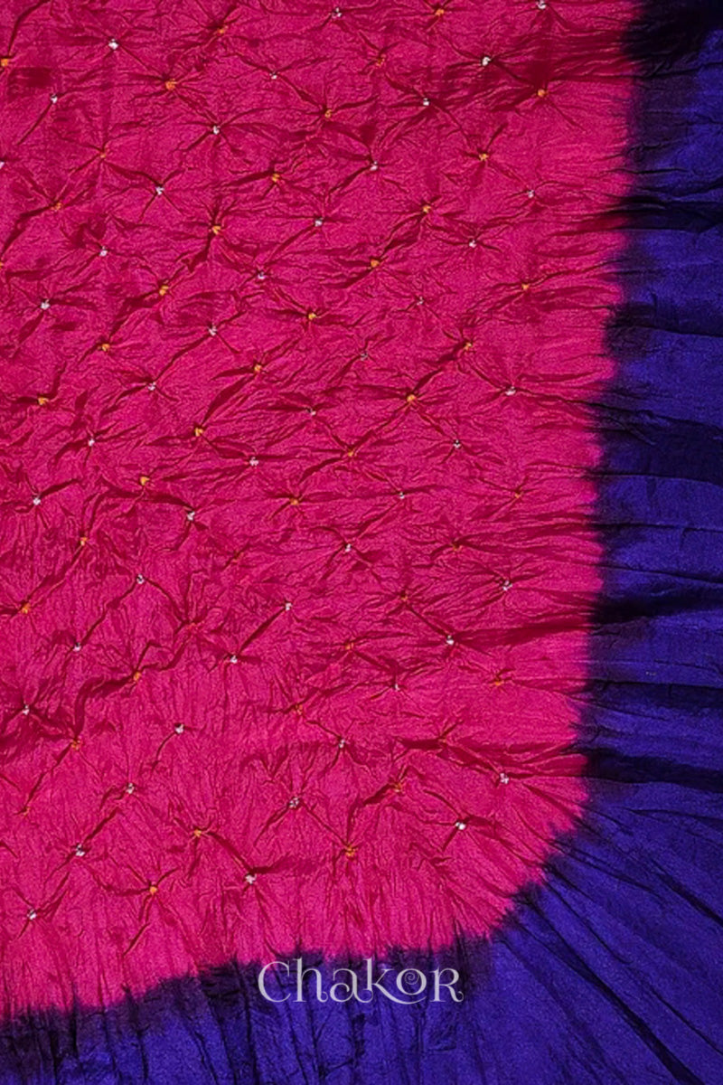 Close up of pink & purple border Bandhani mulberry silk dupatta with tie-dye dot pattern & detailed with Bead edging.