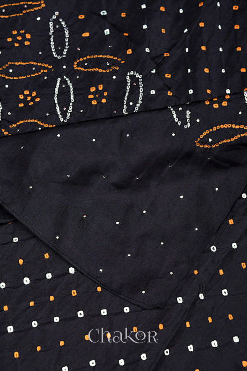 Close up of black Bandhani mulberry silk dupatta with multi colour tie-dye dot pattern & detailed with mukaish work &  Bead edging.