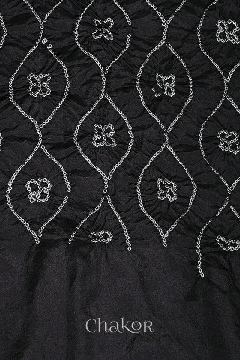 Close up of black Bandhani mulberry silk dupatta with tie-dye dot pattern & detailed with Bead edging.