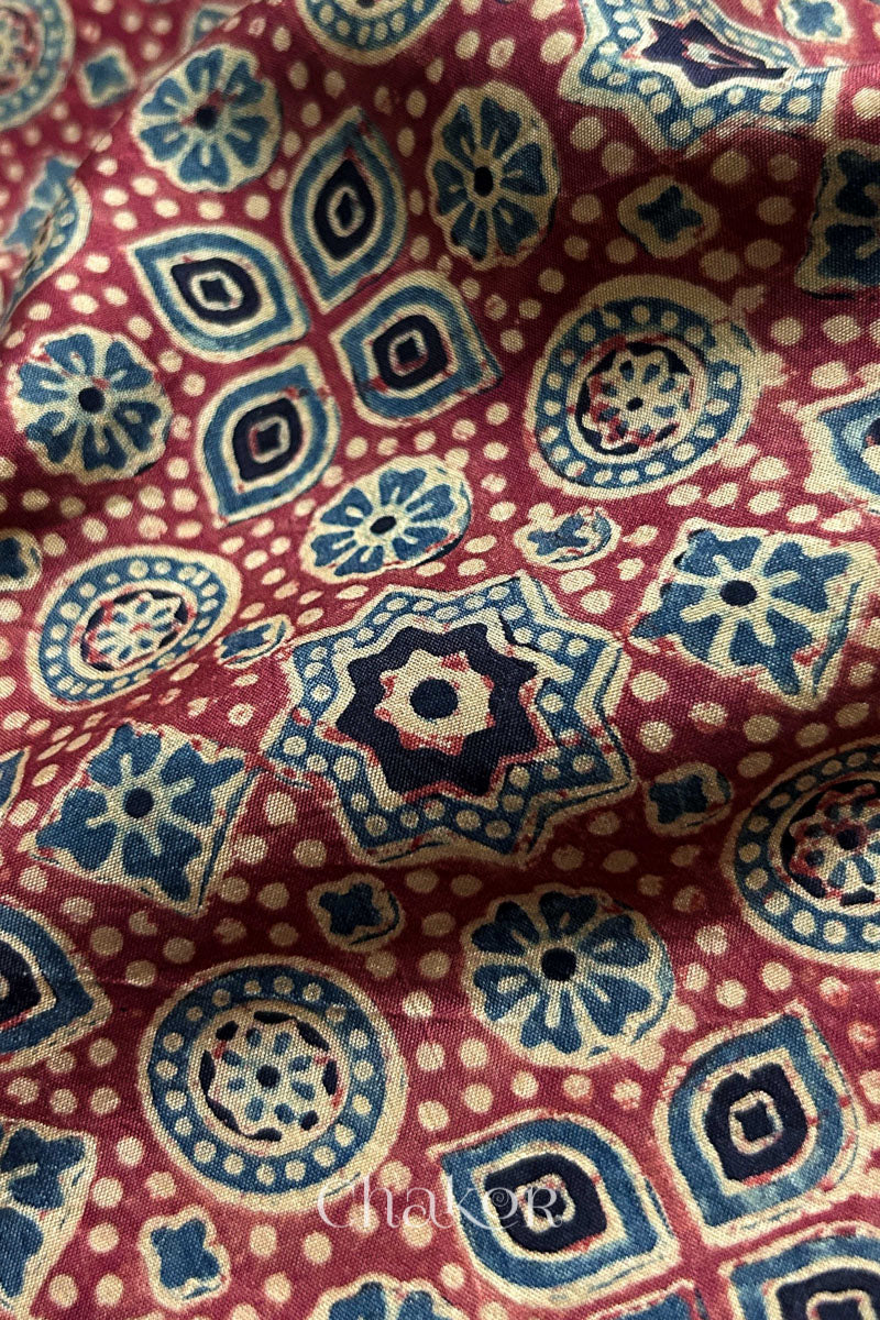 Detailed view of natural vegetable dyes on pure Mulberry silk blouse material.