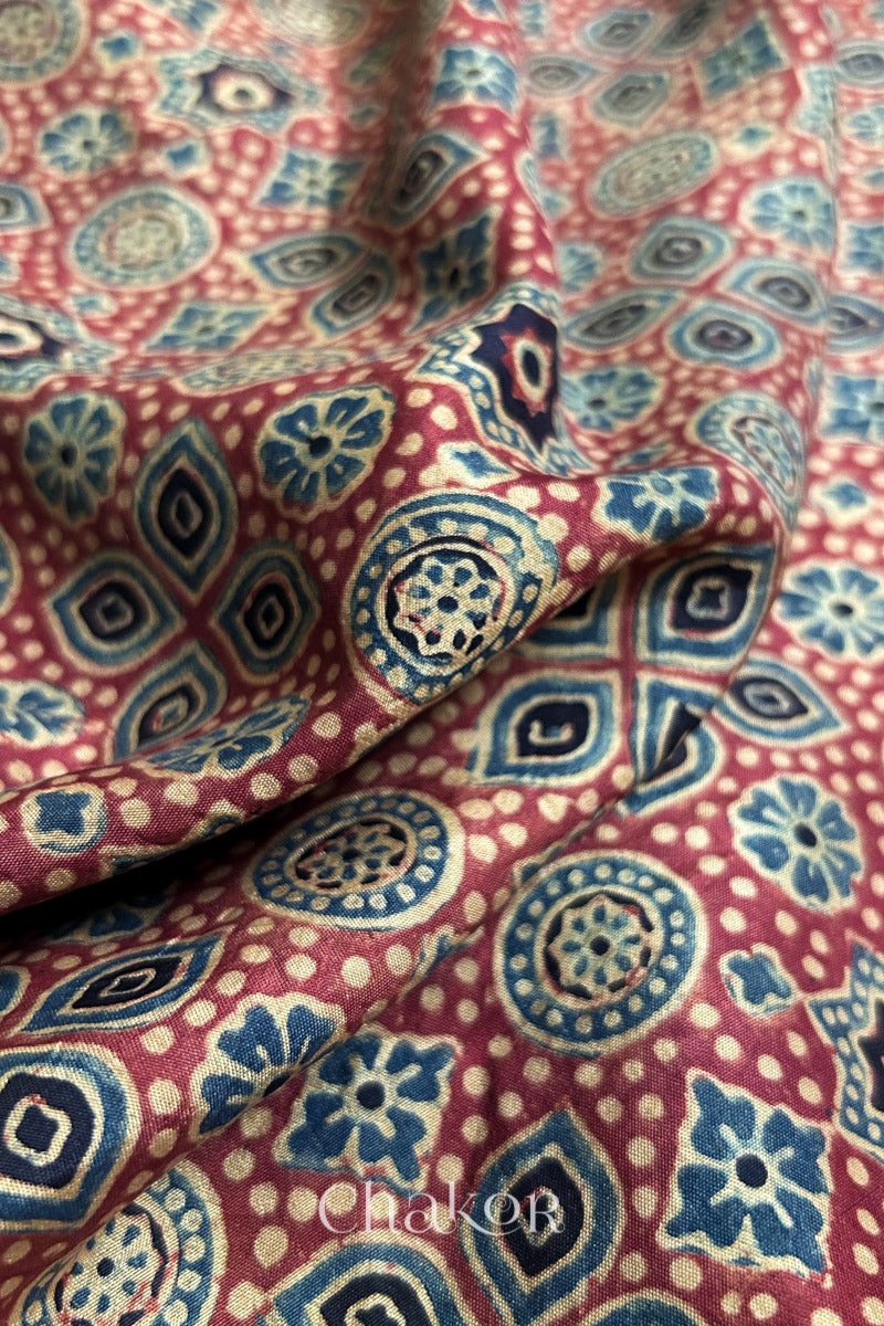 Soft texture and intricate block print detail of red handloom South silk.