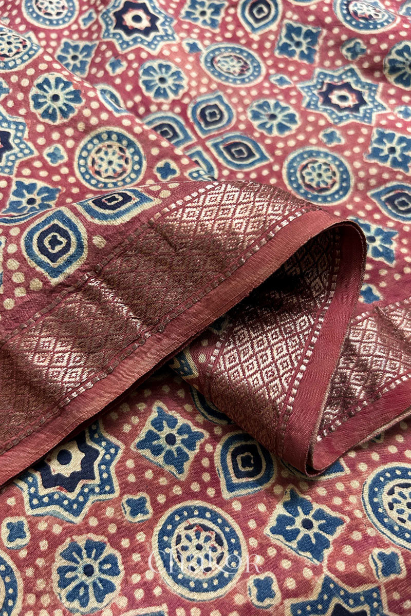 Close-up of fine handloom Zari border on pure Mulberry silk blouse fabric.