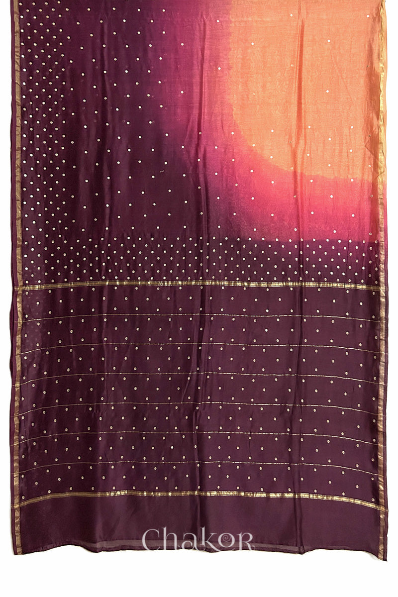 Flat view of peach maroon shaded Chanderi silk cotton saree showing ombre transition and border finish.
