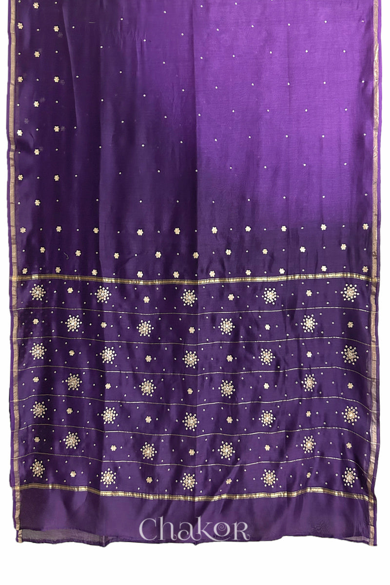 Flat view of violet purple shaded Chanderi silk cotton saree showing ombre transition and border finish.
