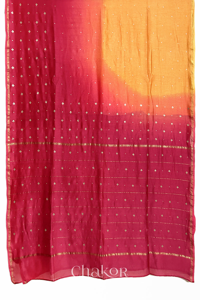 Flat view of yellow pink shaded Chanderi silk cotton saree showing ombre transition and border finish.
