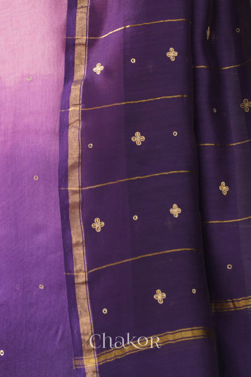 Close-up of hand-embroidered sequin and zari work on pink purple Chanderi silk cotton saree.
