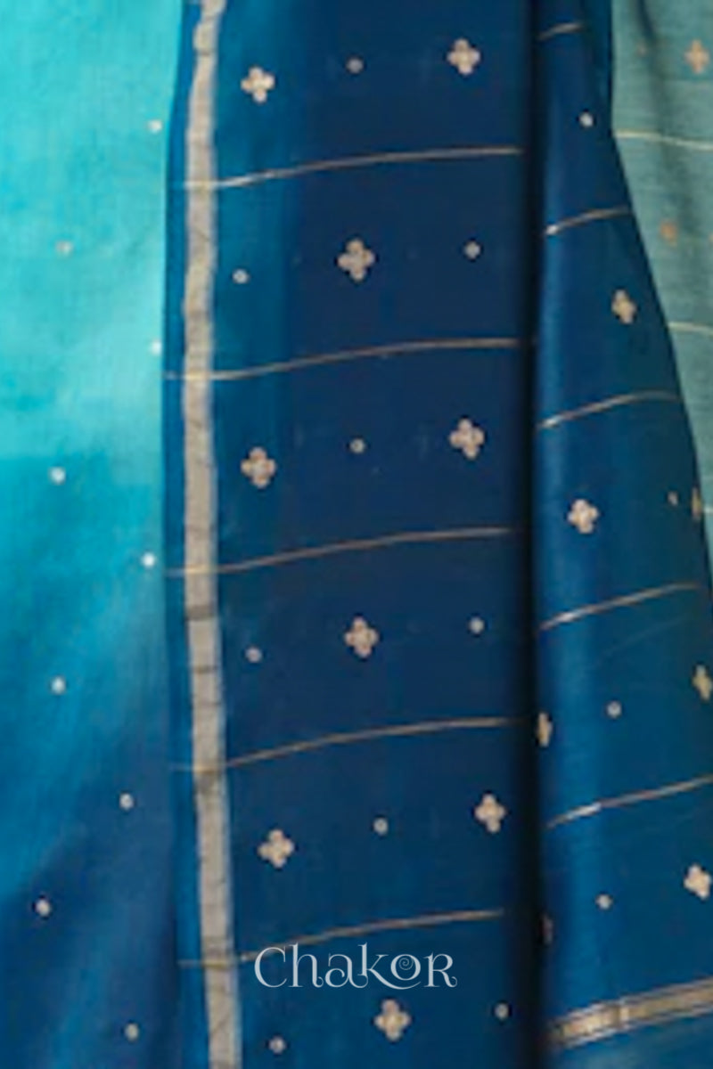 Close-up of hand-embroidered sequin and zari work on turquoise navy Chanderi silk cotton saree.
