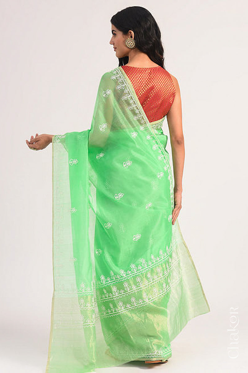 Back view of sea green Chanderi silk cotton saree displaying tissue pallu and embroidery placement.
