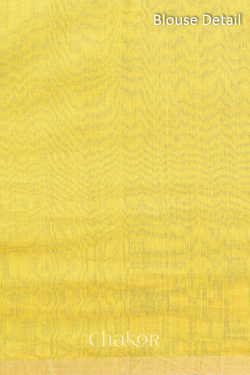 Blouse fabric detail in yellow Chanderi silk cotton with woven texture.
