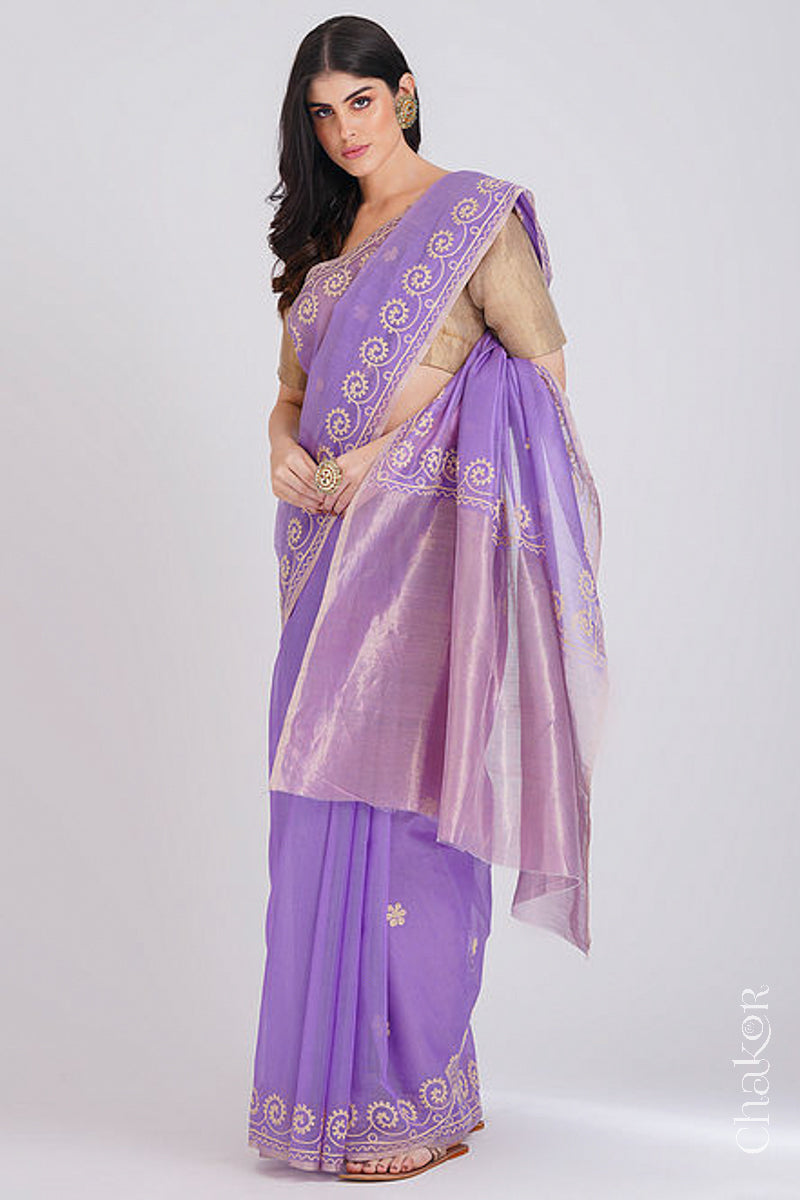 Full-length view of lavender Chanderi silk cotton saree draped to show handloom texture and embroidery and tissye pallu.