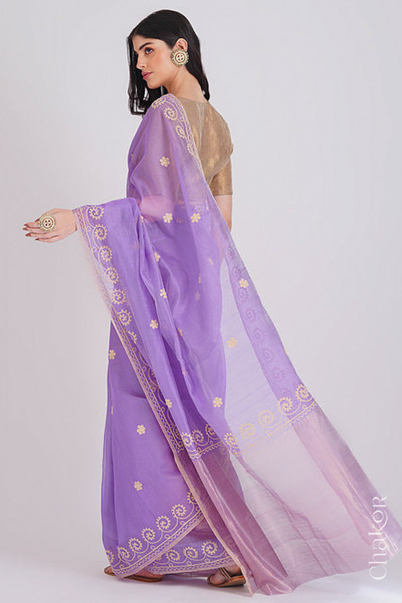 Back view of lavender Chanderi silk cotton saree displaying tissue pallu and embroidery placement.
