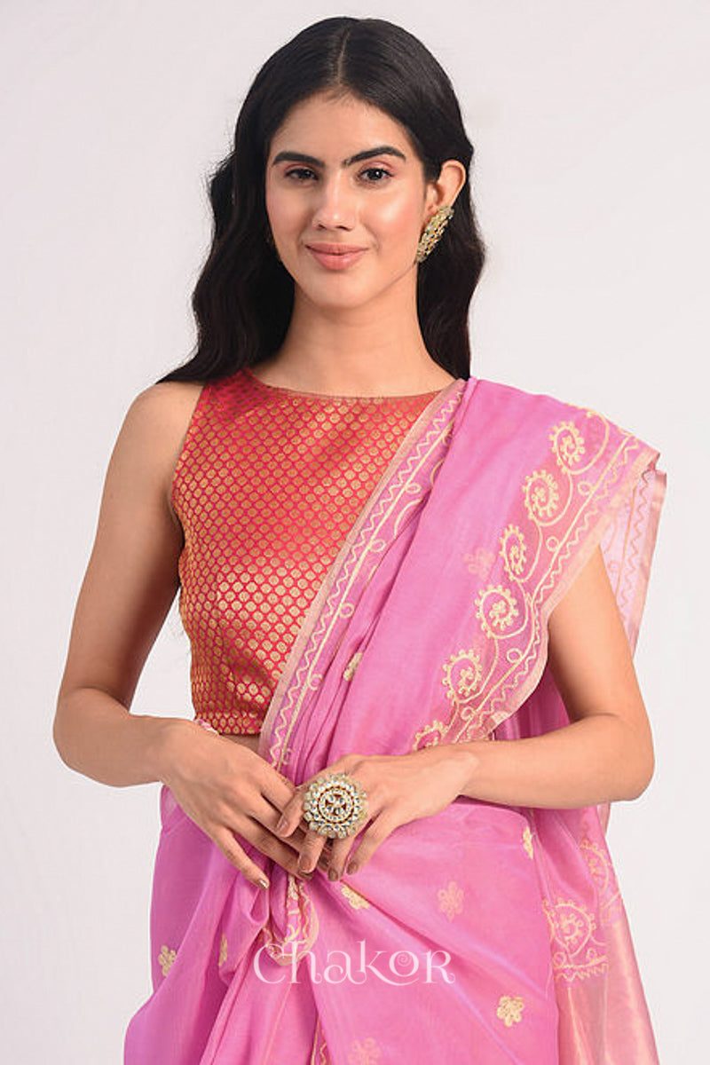 Front close view of pink Chanderi silk cotton saree highlighting aari embroidery details.
