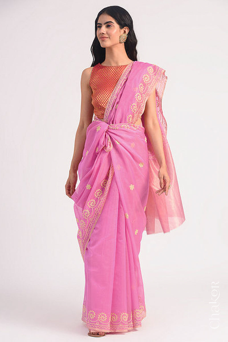 Full-length view of pink Chanderi silk cotton saree draped to show handloom texture and embroidery.
