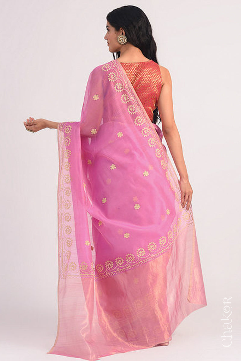 Back view of pink Chanderi silk cotton saree displaying tissue pallu and embroidery placement.
