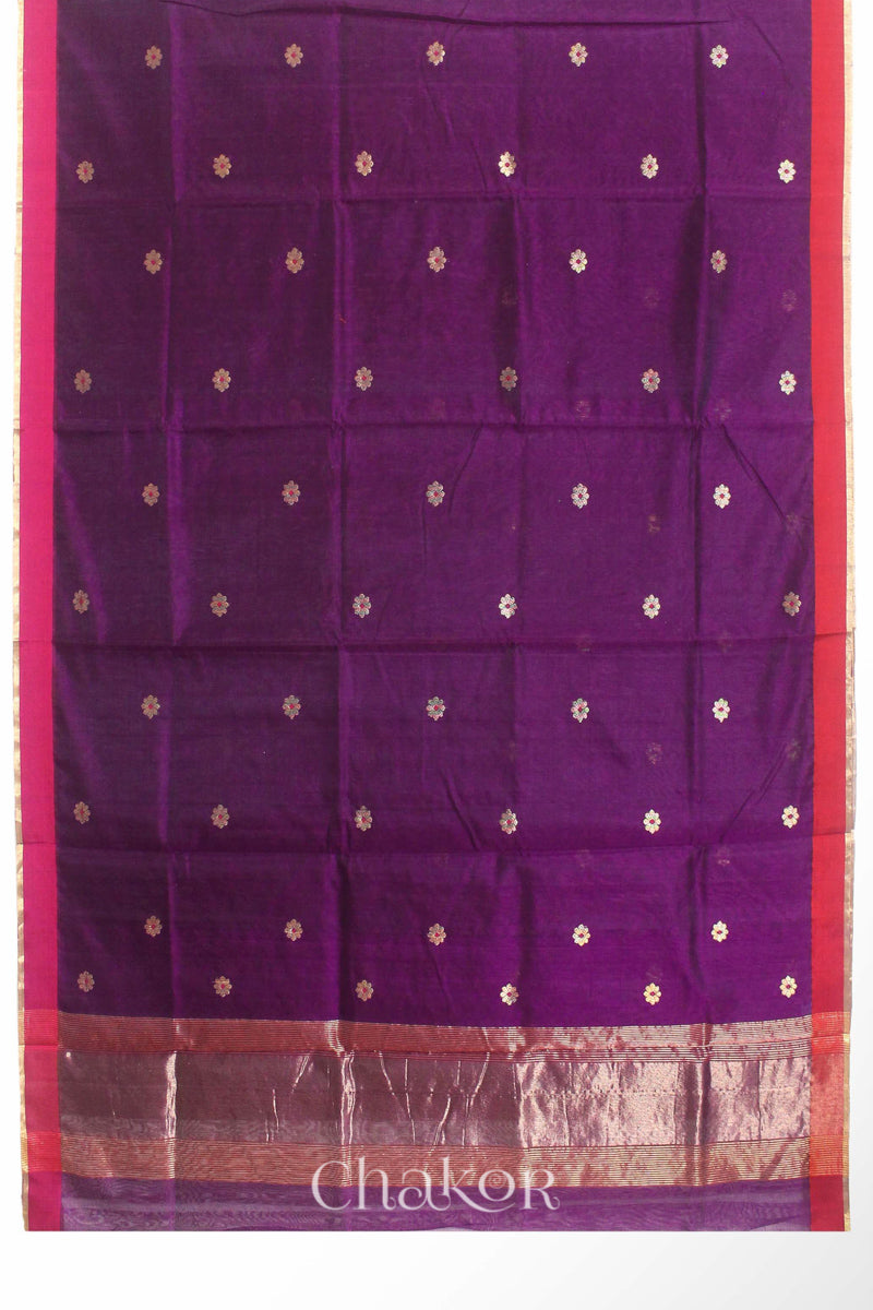 Flatshot of Magenta Chanderi silk cotton saree showing phool butti motifs and contrasting borders.
