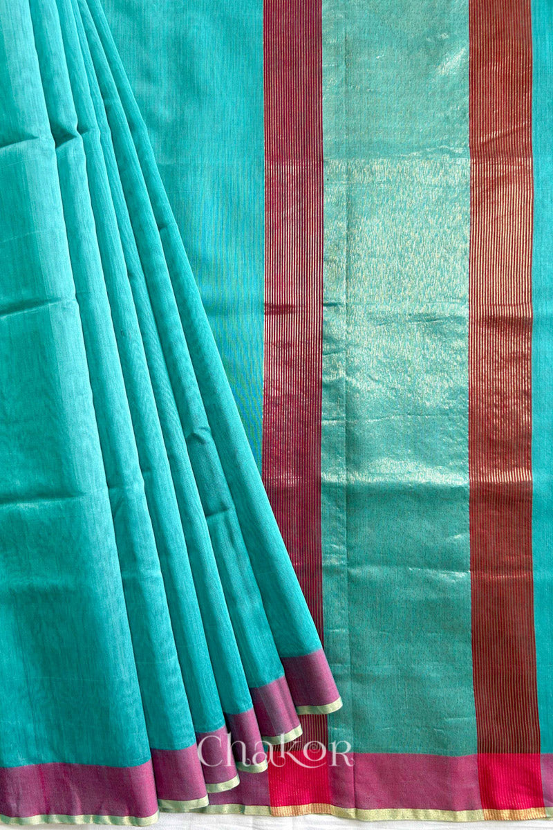 Flatshot of pleats of Handloom Sea Blue Chanderi silk cotton saree showing the woven pattern and soft drape.
