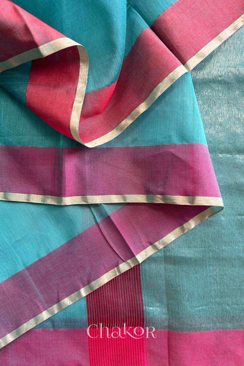 Close-up of the woven texture of Sea Blue Chanderi silk cotton fabric.
