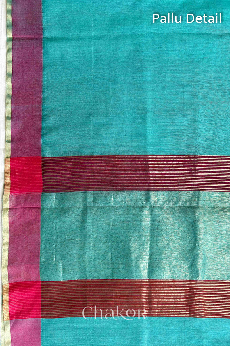 Close-up of the tissue pallu on a Sea Blue Chanderi silk cotton saree, showing the woven texture.
