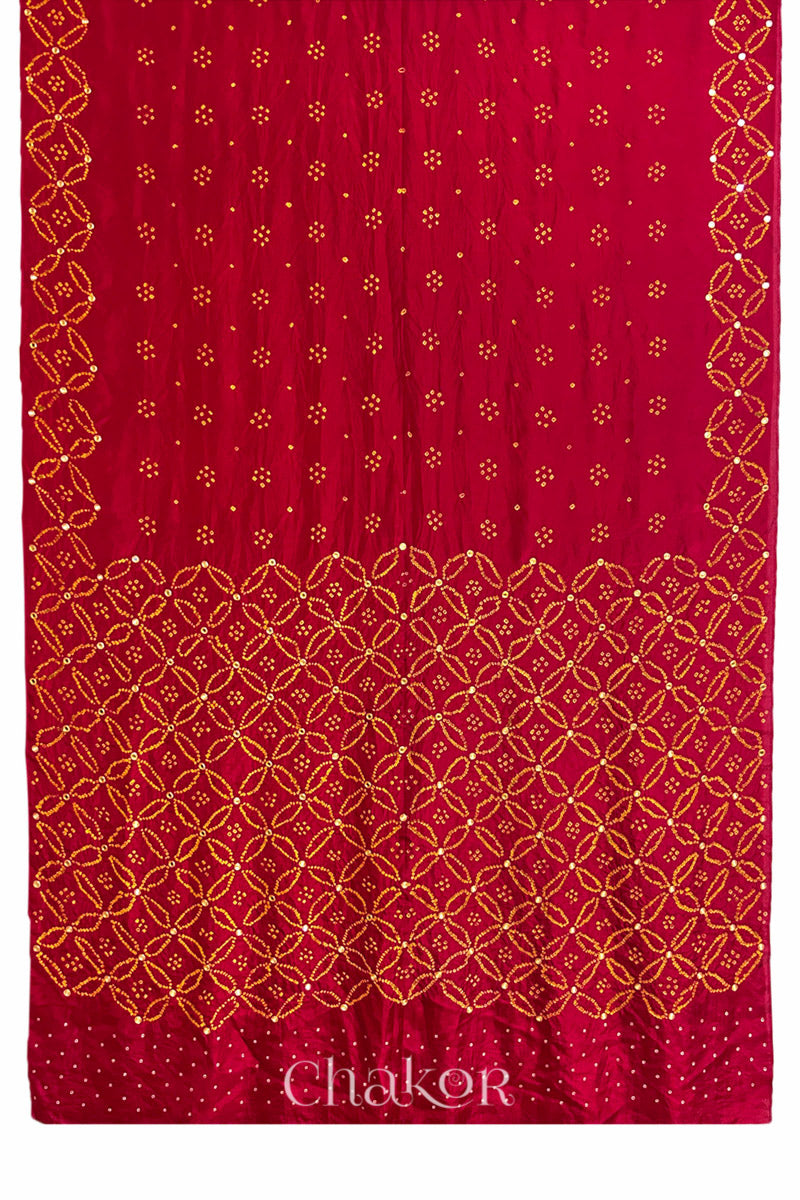 Full view of Red Bandhani Mulberry Silk Saree handcrafted with yellow bandhej dots and mirror embroidery.