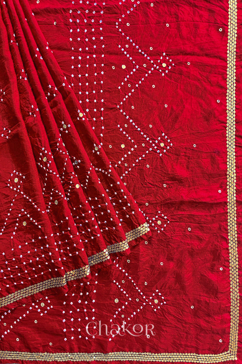 Pleated view of Red Bandhani Mulberry Silk Saree, rai bandhej with sequins embroidery.