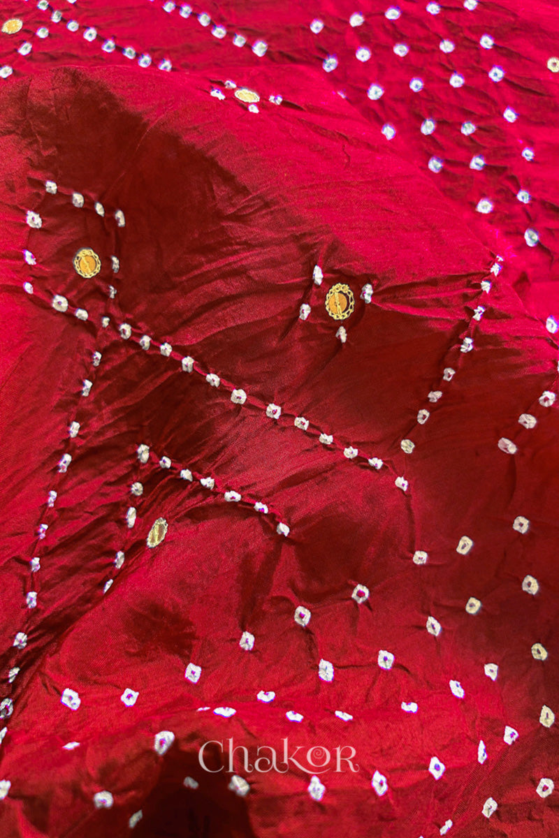 Close up of Red Bandhani Mulberry Silk Saree, rai bandhej with sequins embroidery.