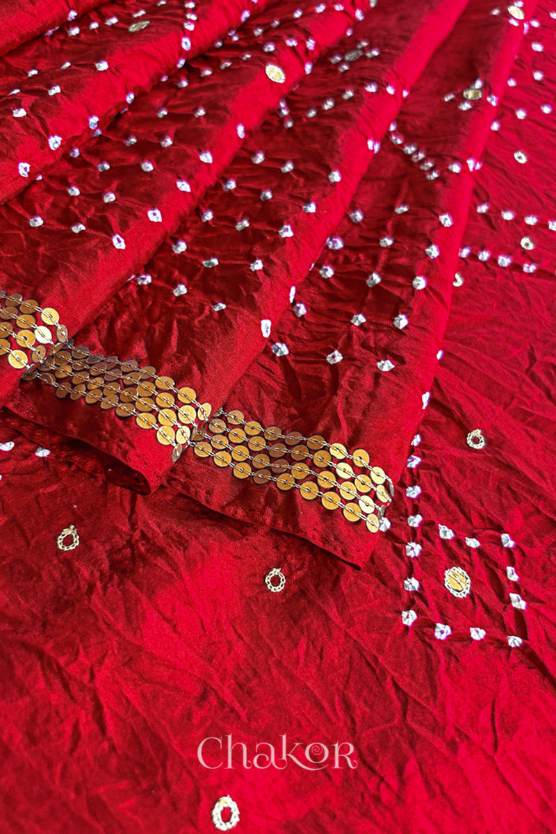 Close up of Red Bandhani Mulberry Silk Saree, rai bandhej with sequins embroidery.